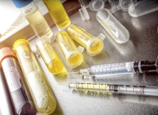 Several vials and syringe in laboratory, conceptual image — Stock Photo, Image