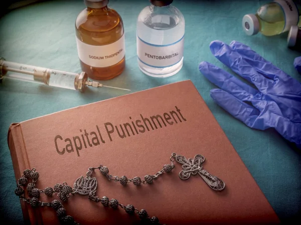 Rosary on a protocol book of the Capital Pinishment, medicines for lethal injection in a hospital, conceptual image — Stock Photo, Image