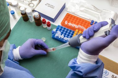 Scientist Investigates Medical Treatment for Covid-19 Coronavirus in Hospital, Spain clipart