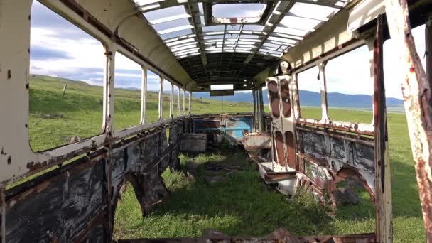 Dolly shot of the rusted auto bus — Stock Video
