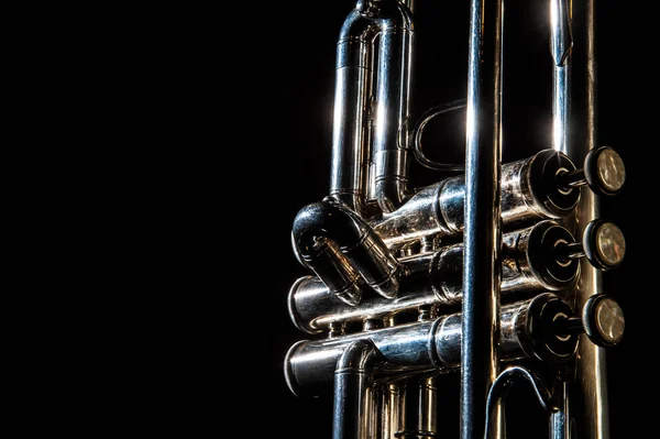 Lonely musical instrument which is a trumpet on a black background — Stock Photo, Image