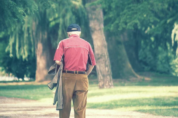 background image of senior walking, lost man with red shirt