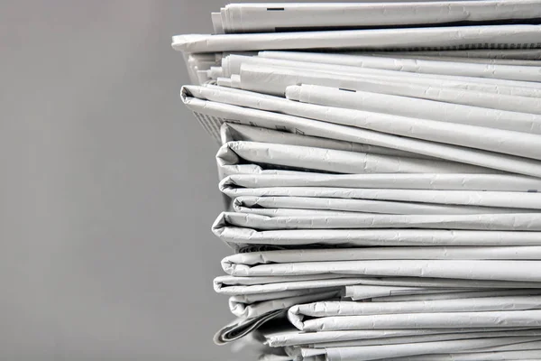 pile of newspapers, tracking shot of a stack of journals