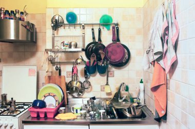 untidiness in a kitchen. Housework to do (ther's a lot of chaos and dirt)