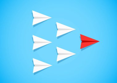 Beyaz uçaklar arasında bir lider olarak kırmızı kağıt uçak. Liderlik, takım çalışması, motivasyon kavramı.