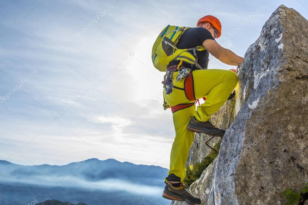 Man climbing a via ferrata