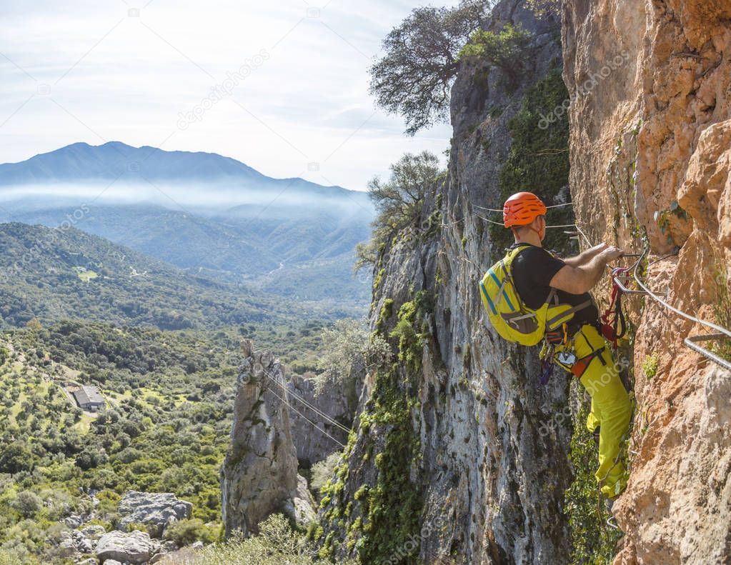 Man climbing a via ferrata