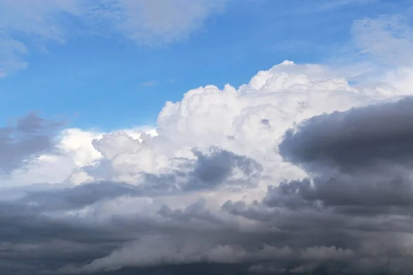 Epic dramatic Storm sky, dark and white big cumulus clouds on blue sky background texture