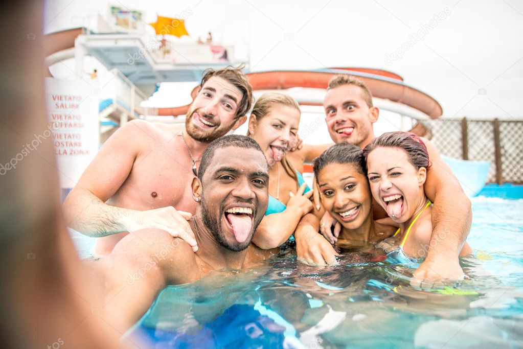 Friends taking selfie in swimming pool