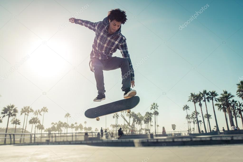 Skater boy practicing at skate park
