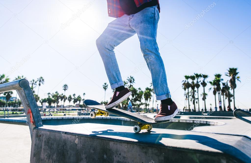 Skateboarder in action at skate park