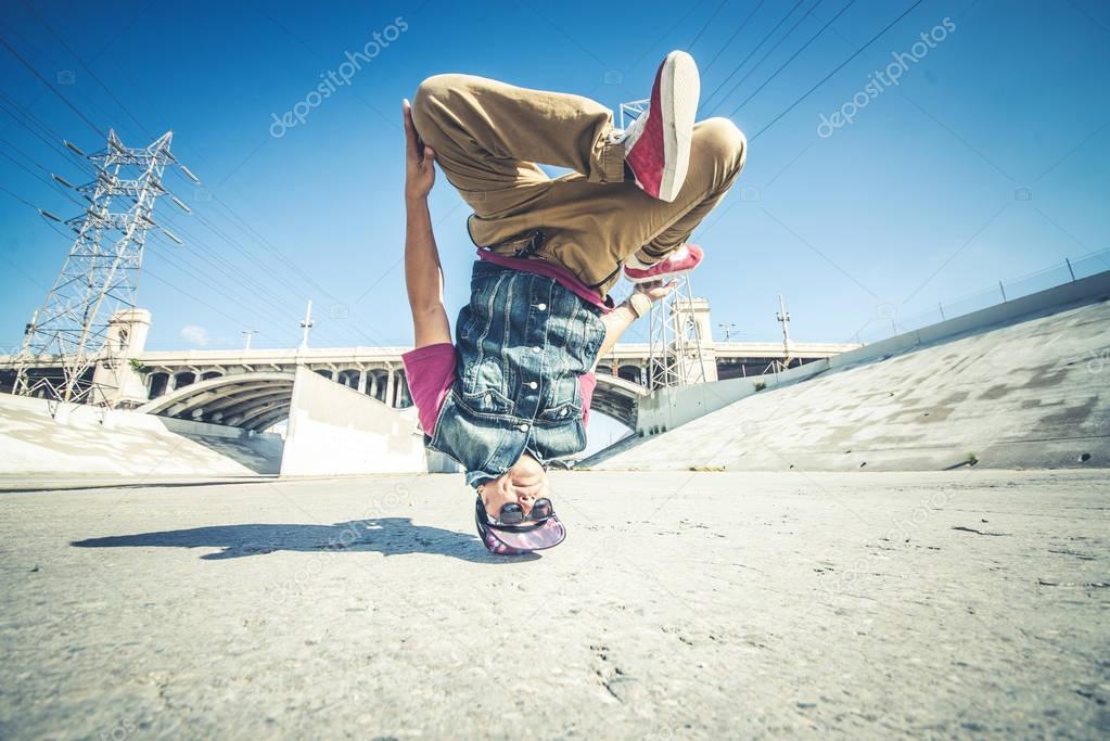 B-boy breakdancing outdoors
