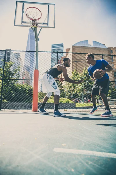 Basketball players training on court