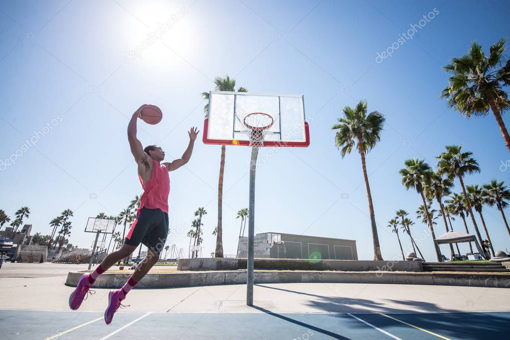 Basketball player making dunk