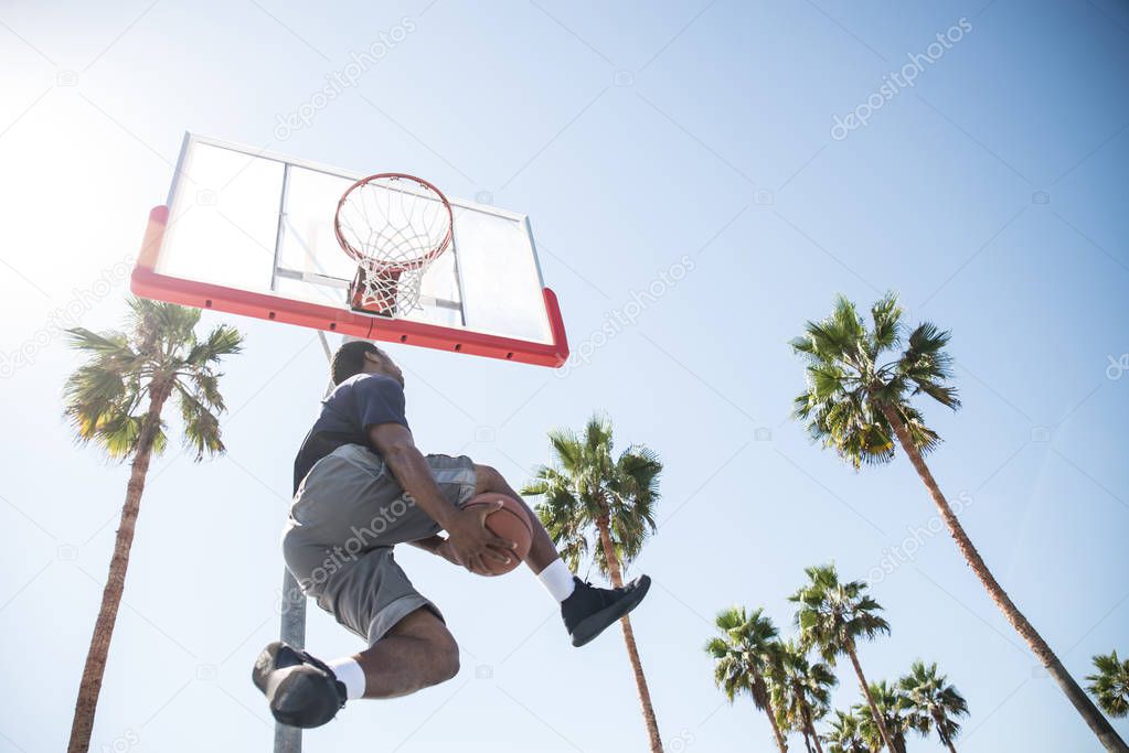 Basketball player making dunk