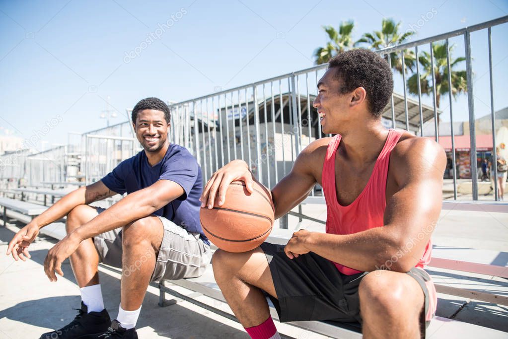 Basketball players resting after competition