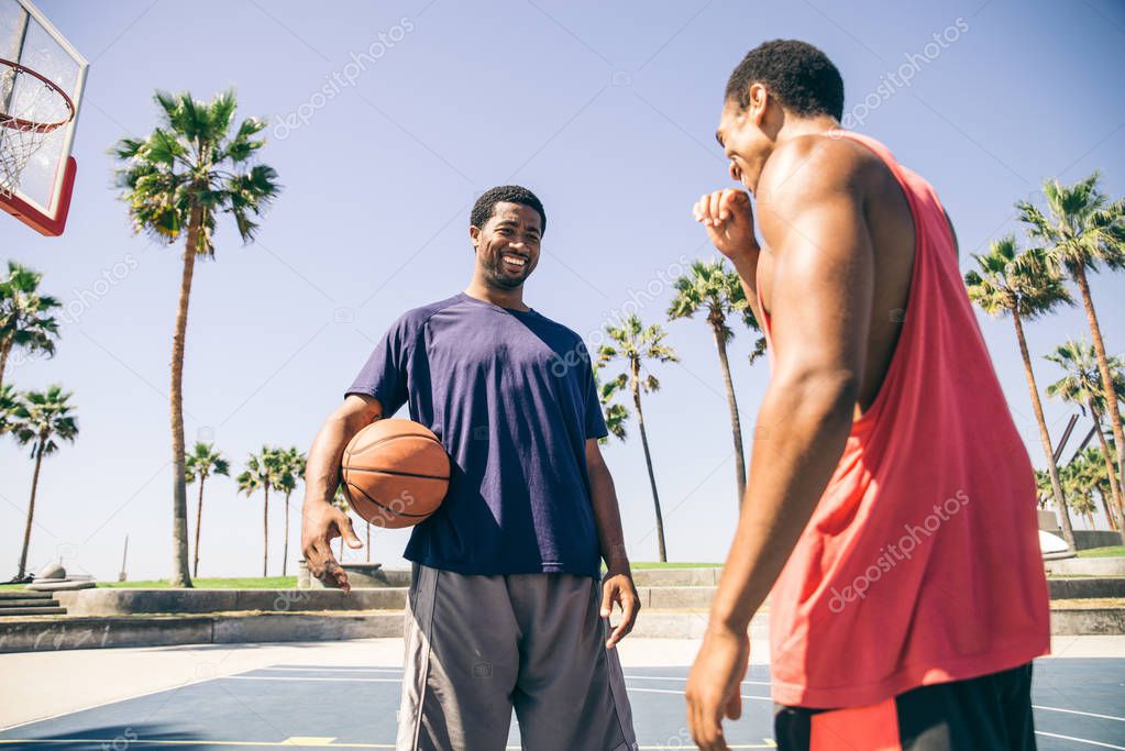 Friends playing basketball 