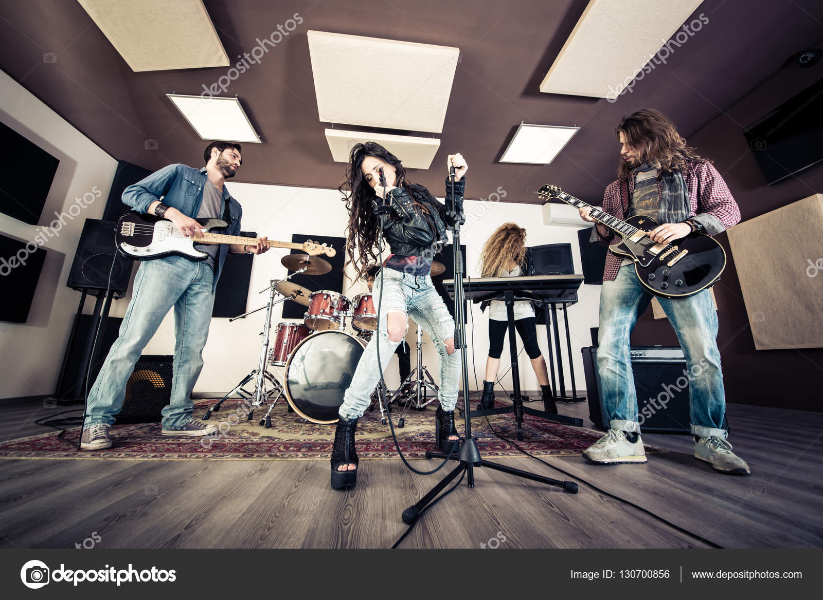 Rock band playing Stock Photo by ©oneinchpunch 130700856