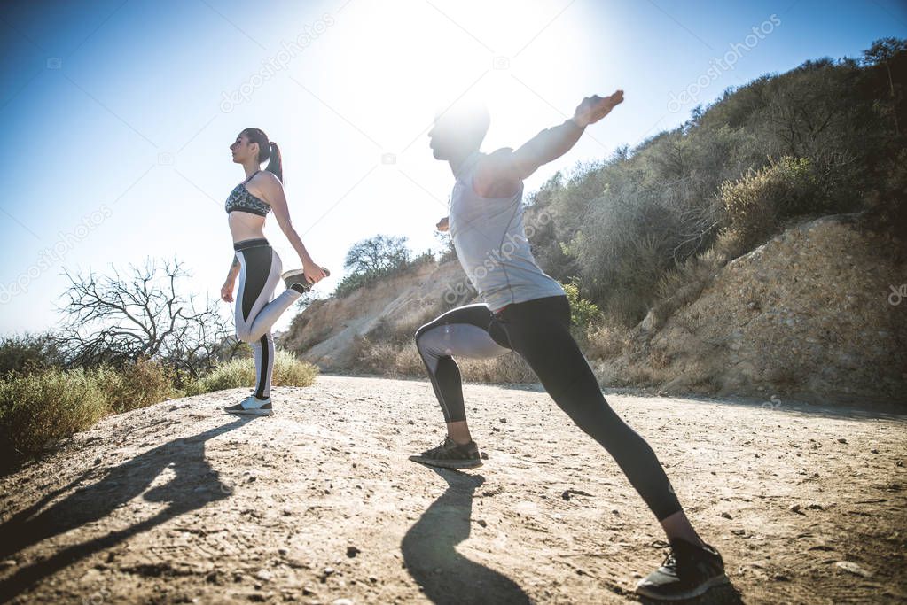 Runners doing stretching 