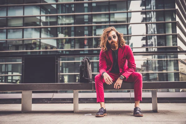 Hipster man in red formal suit — Stock Photo, Image
