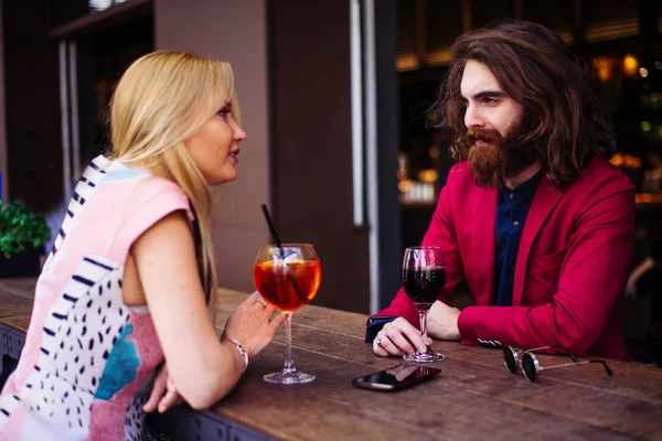 Cheerful couple in cocktail bar