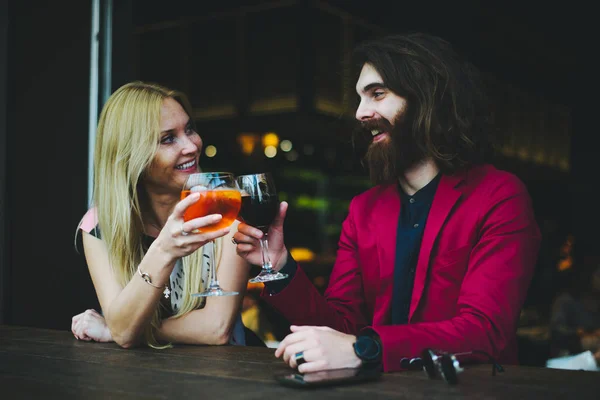 Cheerful couple in cocktail bar