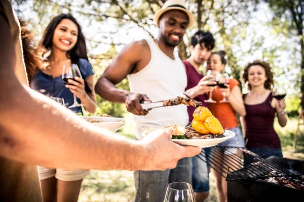 Group of friends making barbecue — Stock Photo, Image