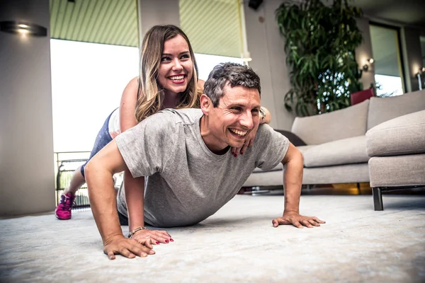 Couple making fitness at home