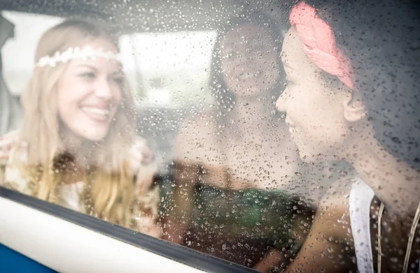 Hippie friends driving on minivan — Stock Photo, Image