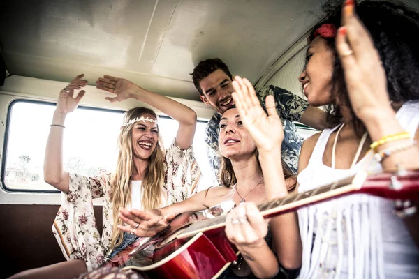 Hippie friends driving on minivan — Stock Photo, Image