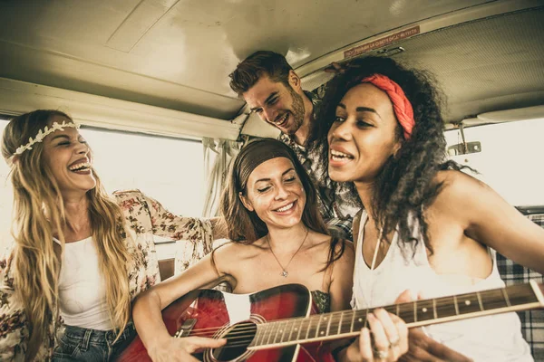 Hippie friends driving on minivan — Stock Photo, Image