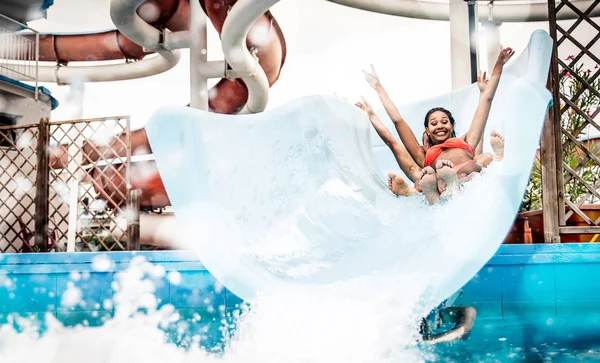 Friends having fun on water glides — Stock Photo, Image