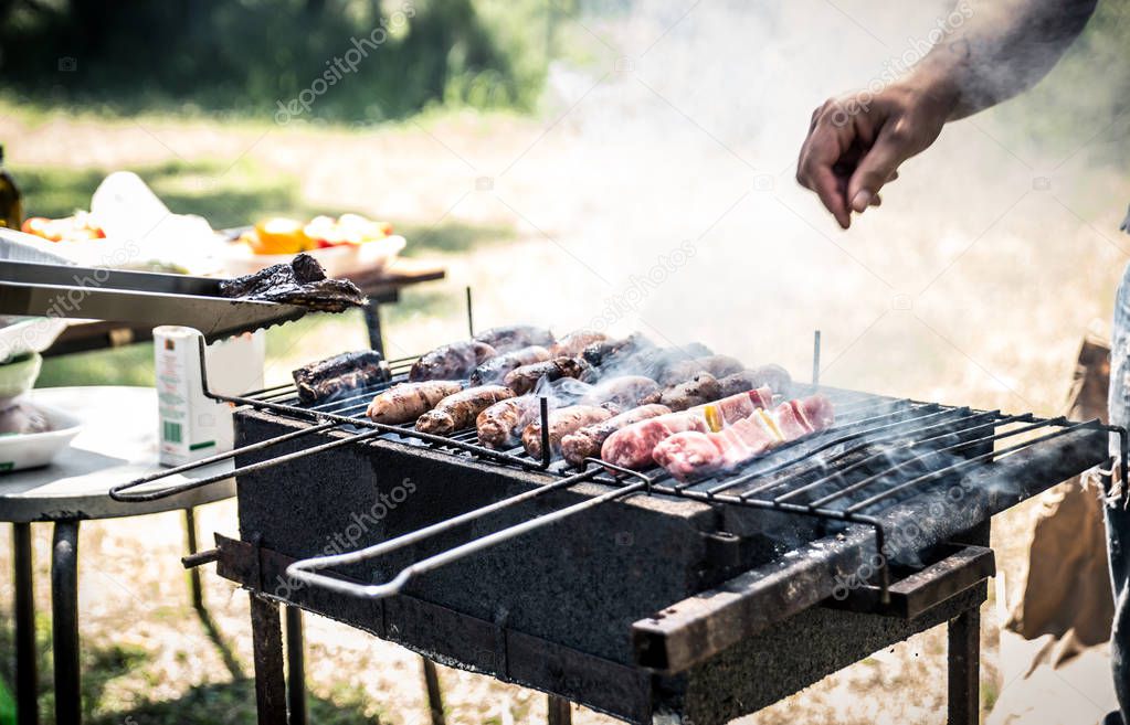 Barbecue grill with meat and sausages