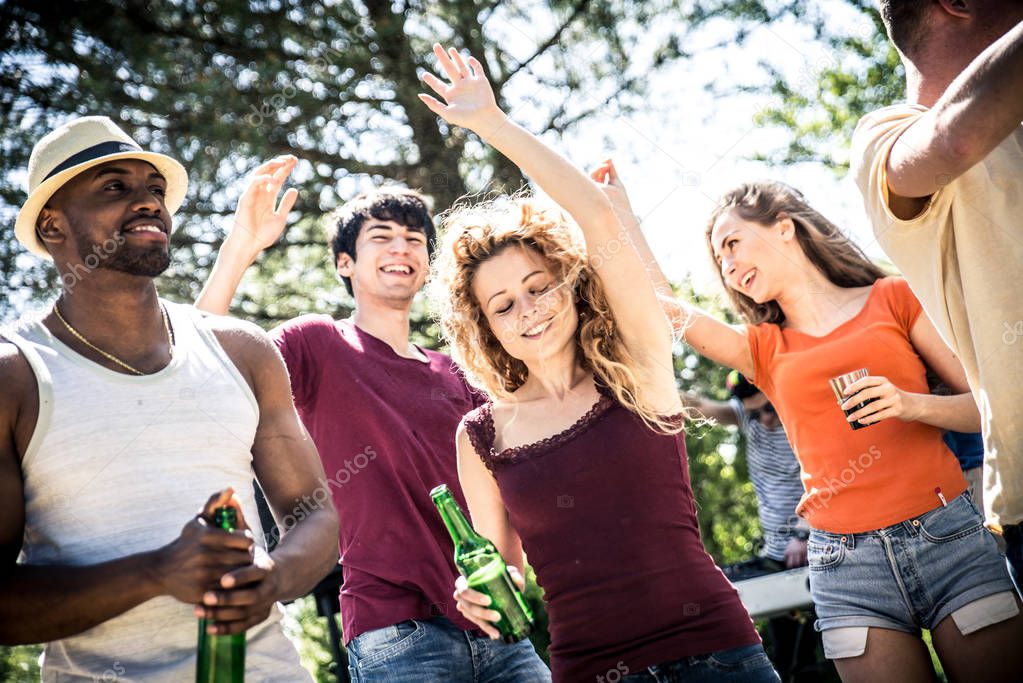 Young people partying and dancing