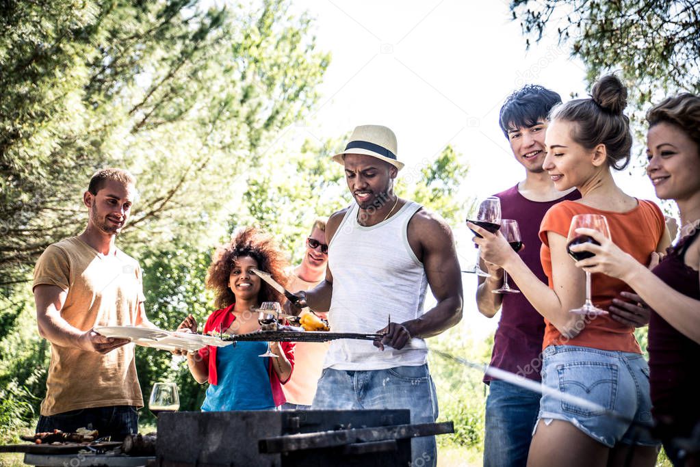 Group of friends making barbecue 