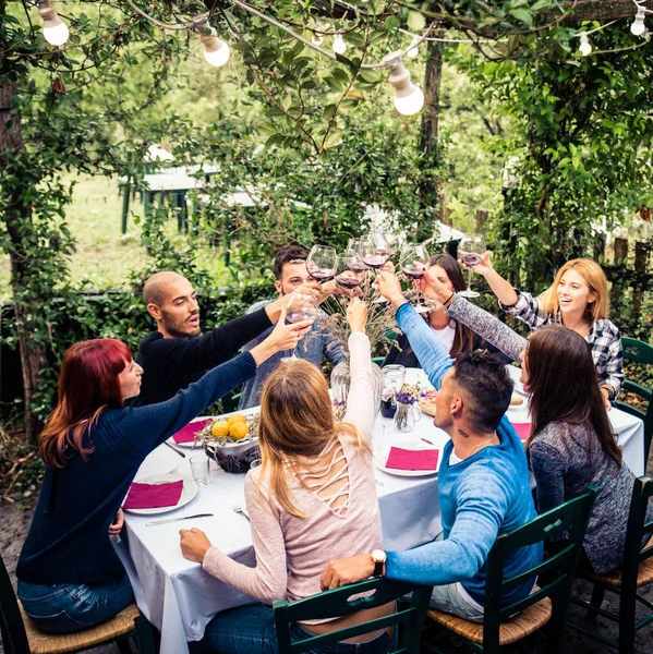 Friends having dinner in garden