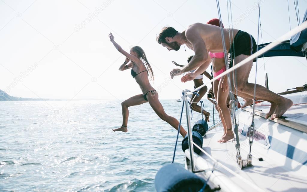 Friends having fun on sailboat 