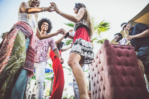 Friends dancing in lounge bar