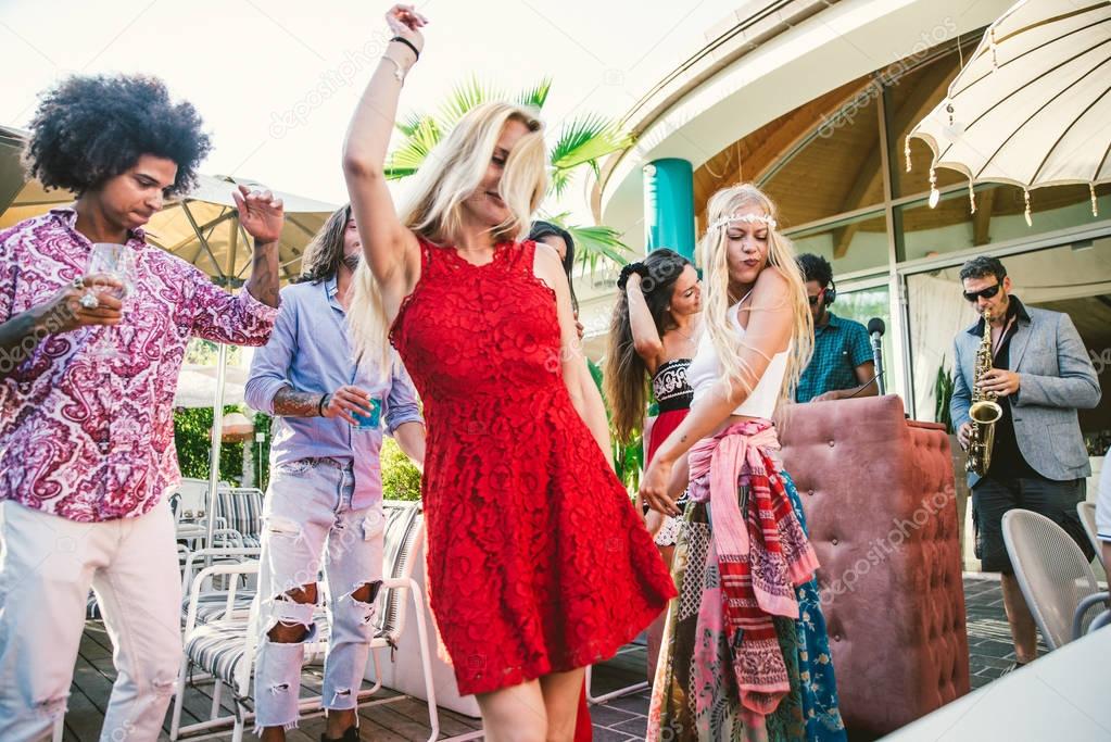 Friends dancing in lounge bar