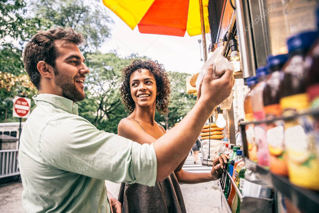 Couple at kiosk in New York