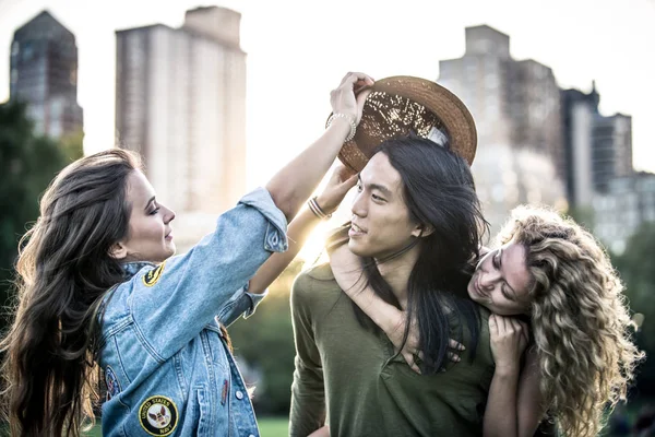 Group of friends having fun in central park — Stock Photo, Image