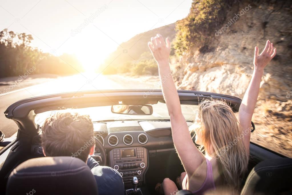 Couple in convertible car