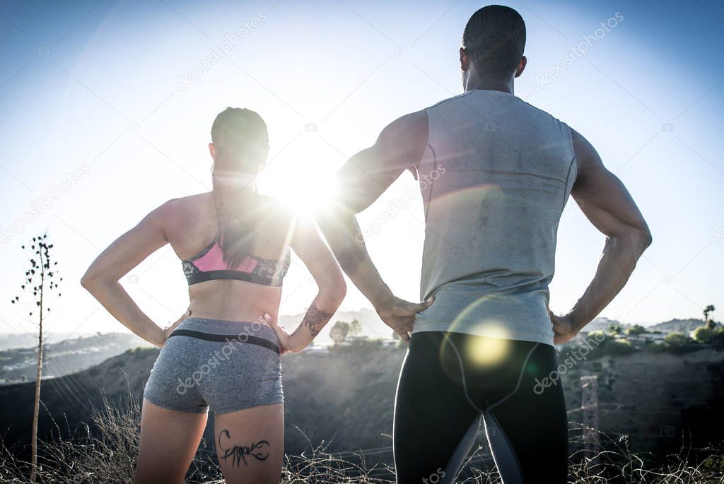 Couple running in los angeles canyons. 