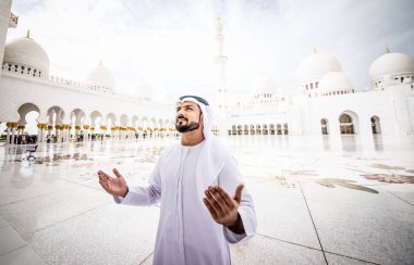 Arabic man praying at mosque clipart