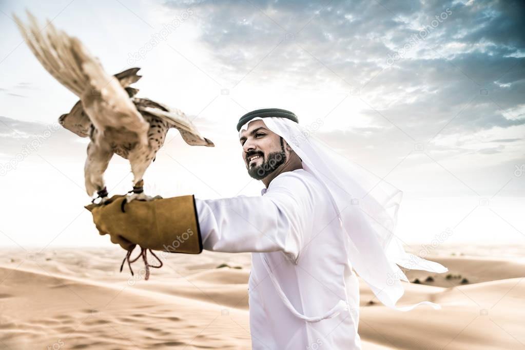 Arabic man with falcon bird