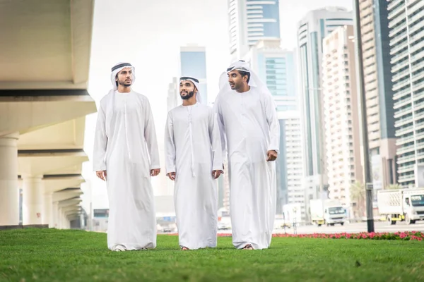 Arabian businessmen walking in Dubai