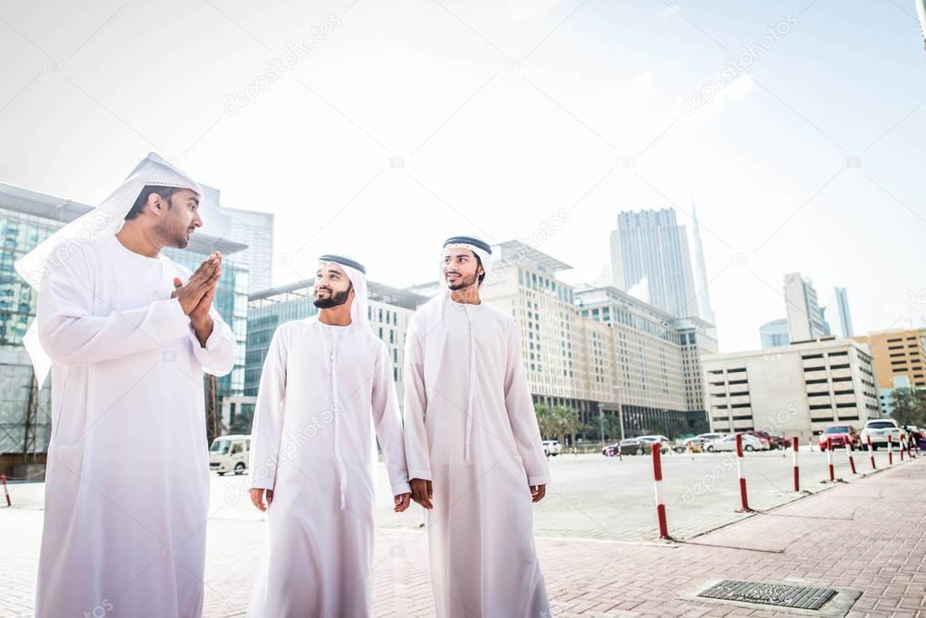 Arabian businessmen walking in Dubai
