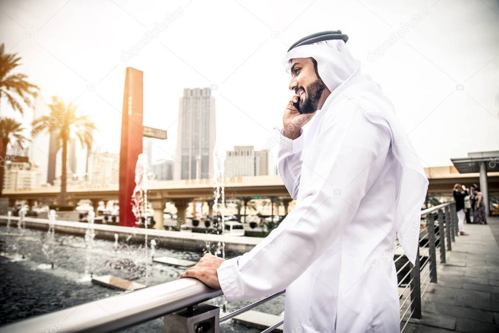 Arabic businessman talking on mobile phone