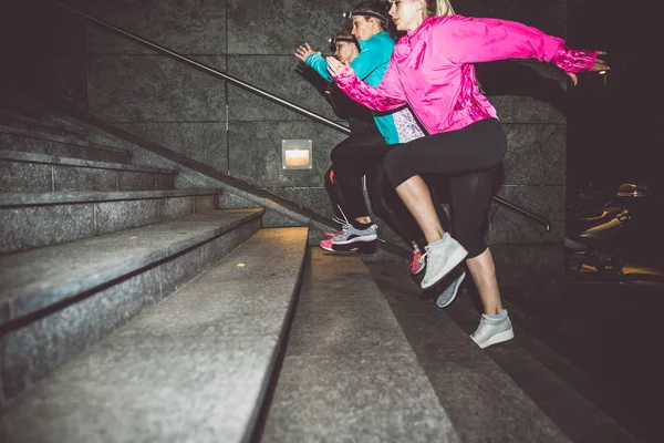 Women running in night — Stock Photo, Image