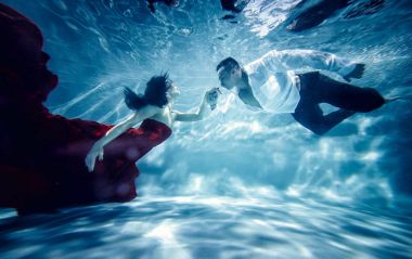 Couple dreamlike situation underwater clipart